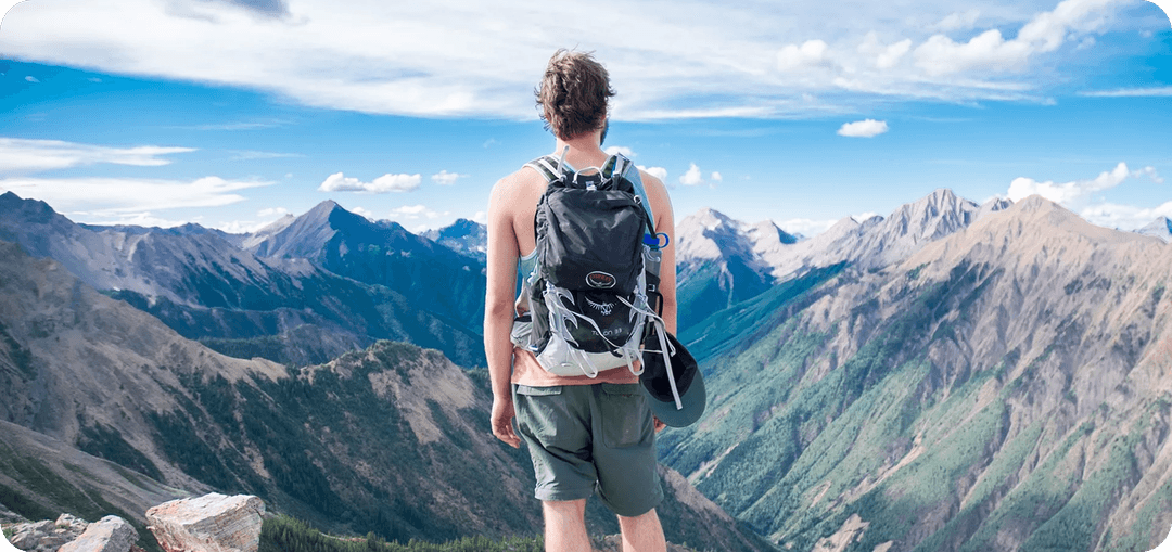 Person hiking with mountain view